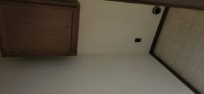 Clinton apartment for rent - an empty room with white walls and a cabinet