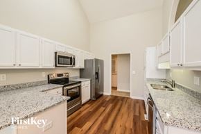 Kernersville house for rent - a kitchen with granite counter tops and stainless steel appliances