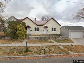 Great Falls apartment for rent - a white house on the side of the street