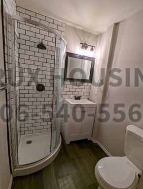 Great Falls apartment for rent - a small bathroom with a toilet and a shower
