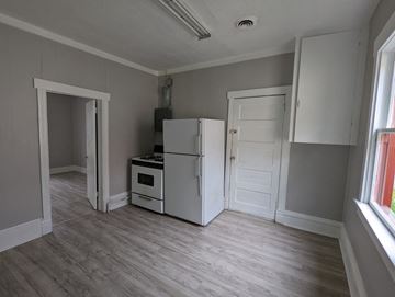Great Falls apartment for rent - a kitchen with a refrigerator and a stove and a door