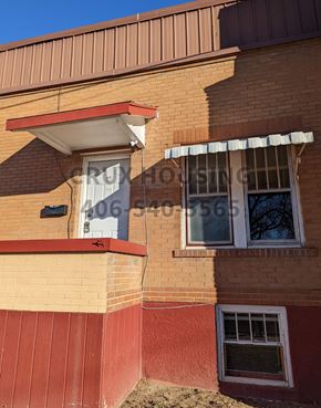 Great Falls apartment for rent - an old brick building with a window and awning