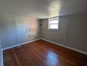 Great Falls apartment for rent - a small room with wooden floors and a window