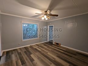 Great Falls house for rent - A room with wooden flooring and a ceiling fan.