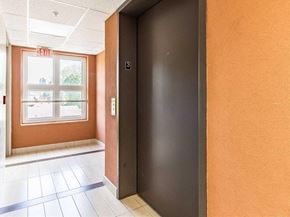 Waterloo apartment for rent - an empty room with a black door and a window