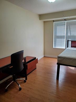 Waterloo apartment for rent - a bedroom with a bed and a desk and a chair