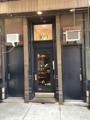 Brooklyn apartment for rent - The front door of a building with the number 160 on it.