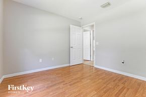 North Port house for rent - a living room with a hard wood floor and a white door