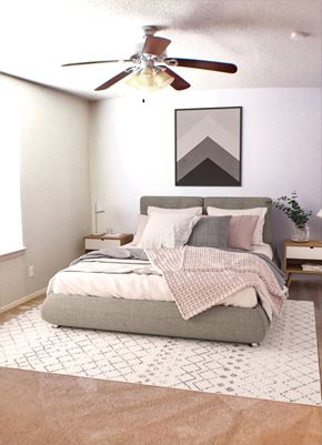 Amarillo apartment for rent - a bedroom with a bed and a ceiling fan