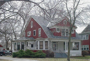 Fremont apartment for rent - a red and white house with a tree in front of it