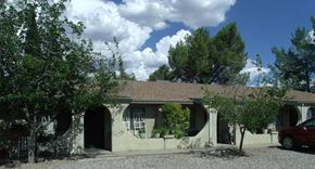 Cottonwood apartment for rent - A house with a red car parked in front.