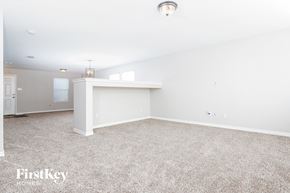 Cedar Hill house for rent - A sparsely furnished room with a carpeted floor and a white ceiling.