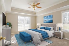 Chelsea house for rent - A bedroom with a bed, nightstand, and a ceiling fan.