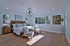 San Jose house for rent - a bedroom with a bed and a chair and a window