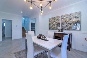 San Jose house for rent - a dining room with a white table and chairs