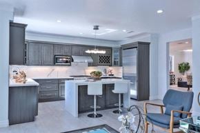 San Jose house for rent - a large kitchen with a bar and gray cabinets