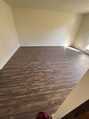 Temple apartment for rent - a empty room with a wooden floor in it