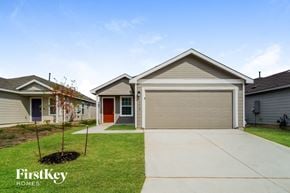 San Antonio house for rent - a house with a driveway and a garage door