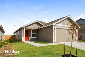 San Antonio house for rent - the front of a house with a lawn and a driveway