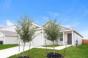 San Antonio house for rent - A modern house with a grey garage door and a grey front door.