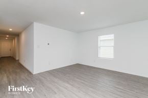 Saint Hedwig house for rent - the living room of a house with white walls and wood floors