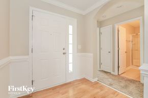 Winston Salem house for rent - a bedroom with two closets and a door to a hallway