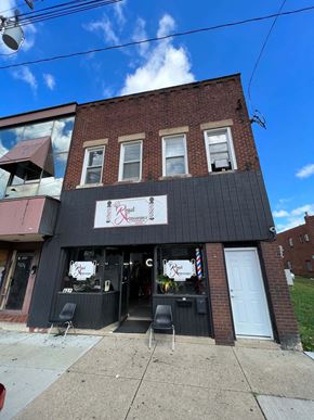Clairton apartment for rent - A building with a sign that says "Mimi's" on it.