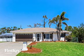 Port Charlotte house for rent - a house with a palm tree in front of it