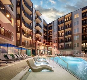 Charlotte apartment for rent - a swimming pool in front of an apartment building