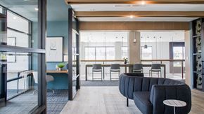 Charlotte apartment for rent - a lounge area with a couch and tables and chairs