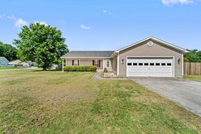 Jacksonville house for rent - A two-car garage is attached to a house.