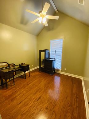 Youngsville house for rent - a living room with wood floors and a ceiling fan