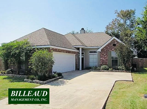 Youngsville house for rent - a house with a driveway and a garage door
