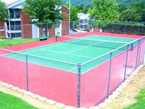Little Rock apartment for rent - a tennis court with a fence around it