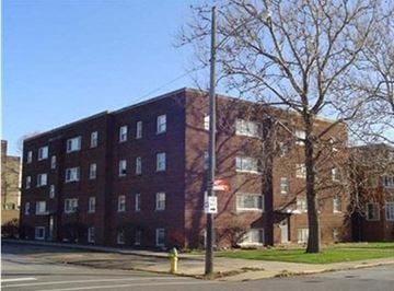 East Chicago apartment for rent - a red brick building on the side of a street