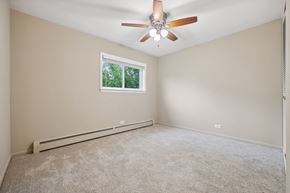 Lombard apartment for rent - an empty living room with a ceiling fan and a window