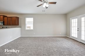 Hockley house for rent - A spacious room with a ceiling fan and a window.