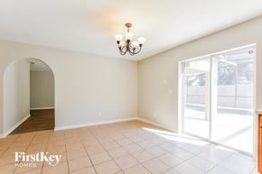 Davenport house for rent - a dining room with a large window and a door to a patio