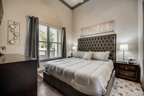 Frisco house for rent - a bedroom with a large bed and a window