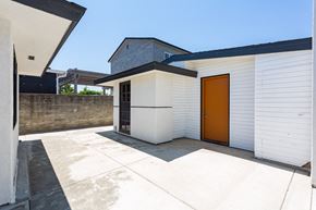 San Diego house for rent - the entrance to the garage of a house with a orange door