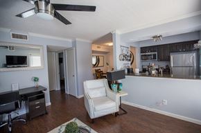 Irving house for rent - the view of a living room and kitchen with a desk and a chair