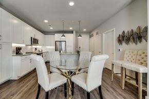 Mckinney house for rent - a kitchen and dining room with a glass table