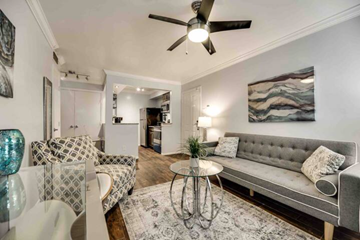 Irving house for rent - a living room with furniture and a ceiling fan
