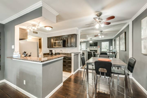 Irving house for rent - a kitchen and dining room with a table and chairs