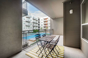 Richardson house for rent - a balcony with a table and chairs and a pool