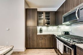 Richardson house for rent - a kitchen with a stove and a microwave