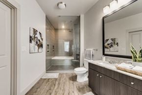 Richardson house for rent - a bathroom with a toilet sink and a shower