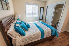 San Antonio house for rent - a bedroom with a bed and a window and a closet