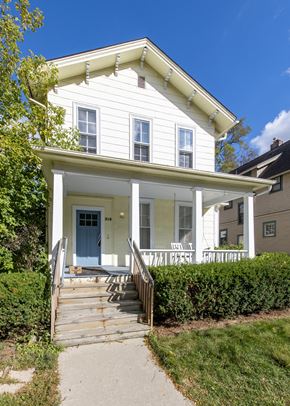 Ann Arbor apartment for rent - a white house with a porch and a blue door