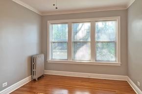 Oak Park apartment for rent - A room with a window and a radiator on the floor.